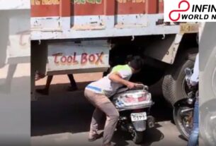 Watch: Video of Man Carrying His Scooter Beneath a Truck to Escape Traffic Goes Viral
